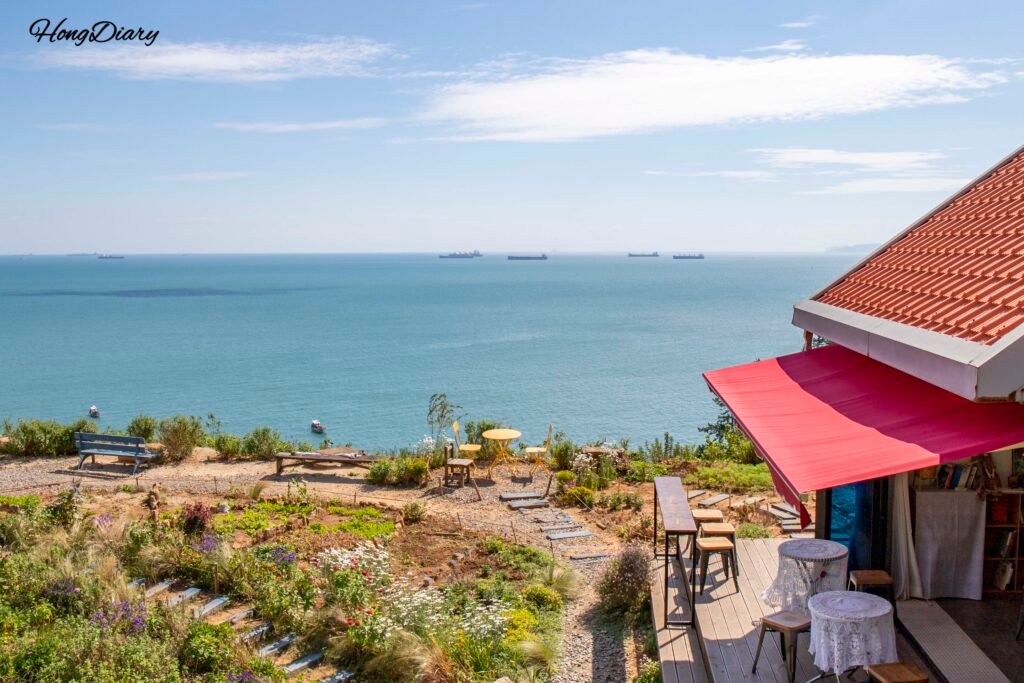 Cafe Tol with Gacheon terraced village and sea stretching into the horizon