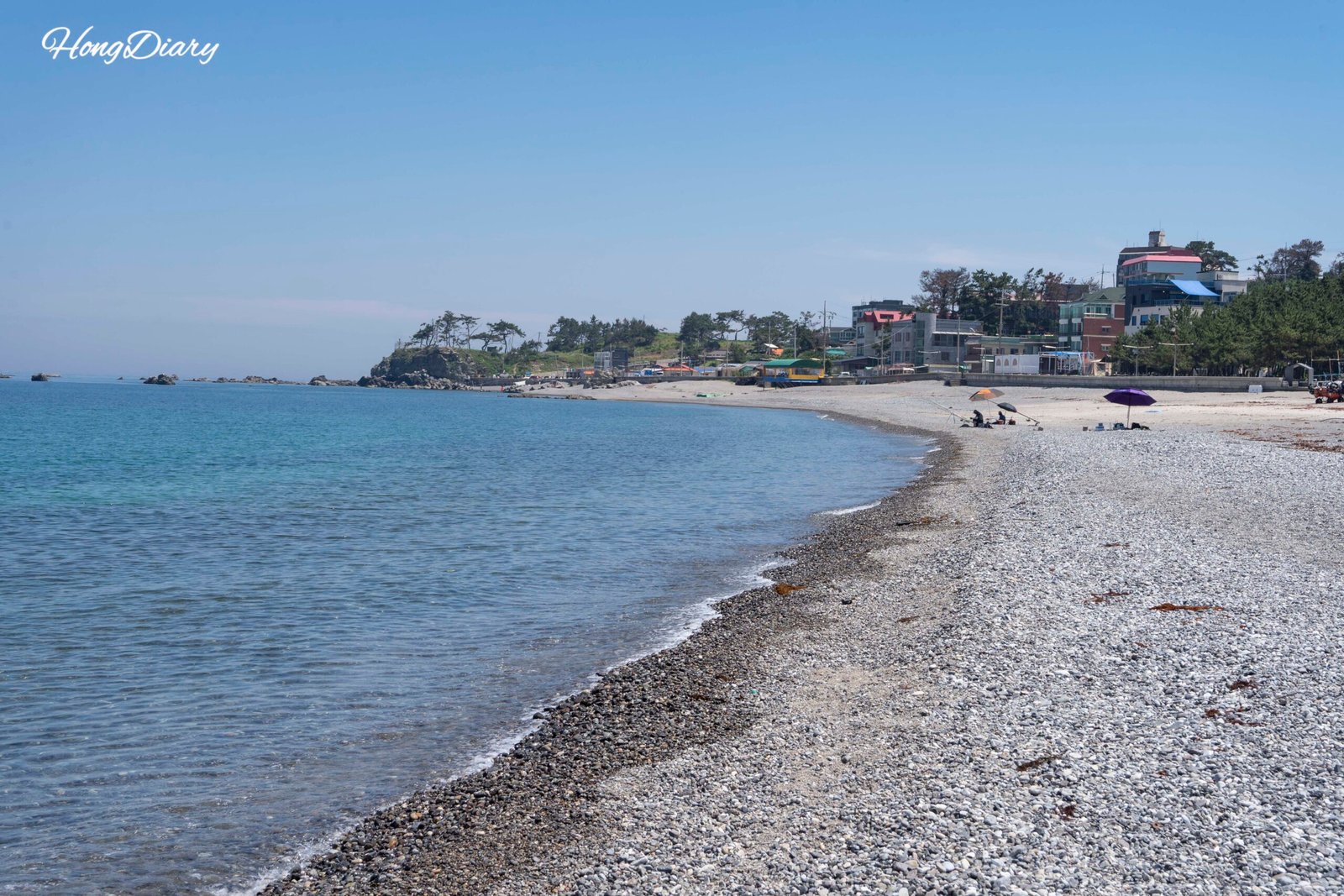 Oryugo Ara Beach in Gyeongju with clear blue water and pine trees