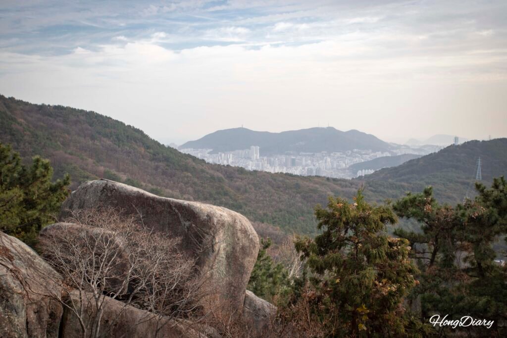 View of Busan city skyline and Yeongdo Island seen from inside Seokbulsa Temple grounds
