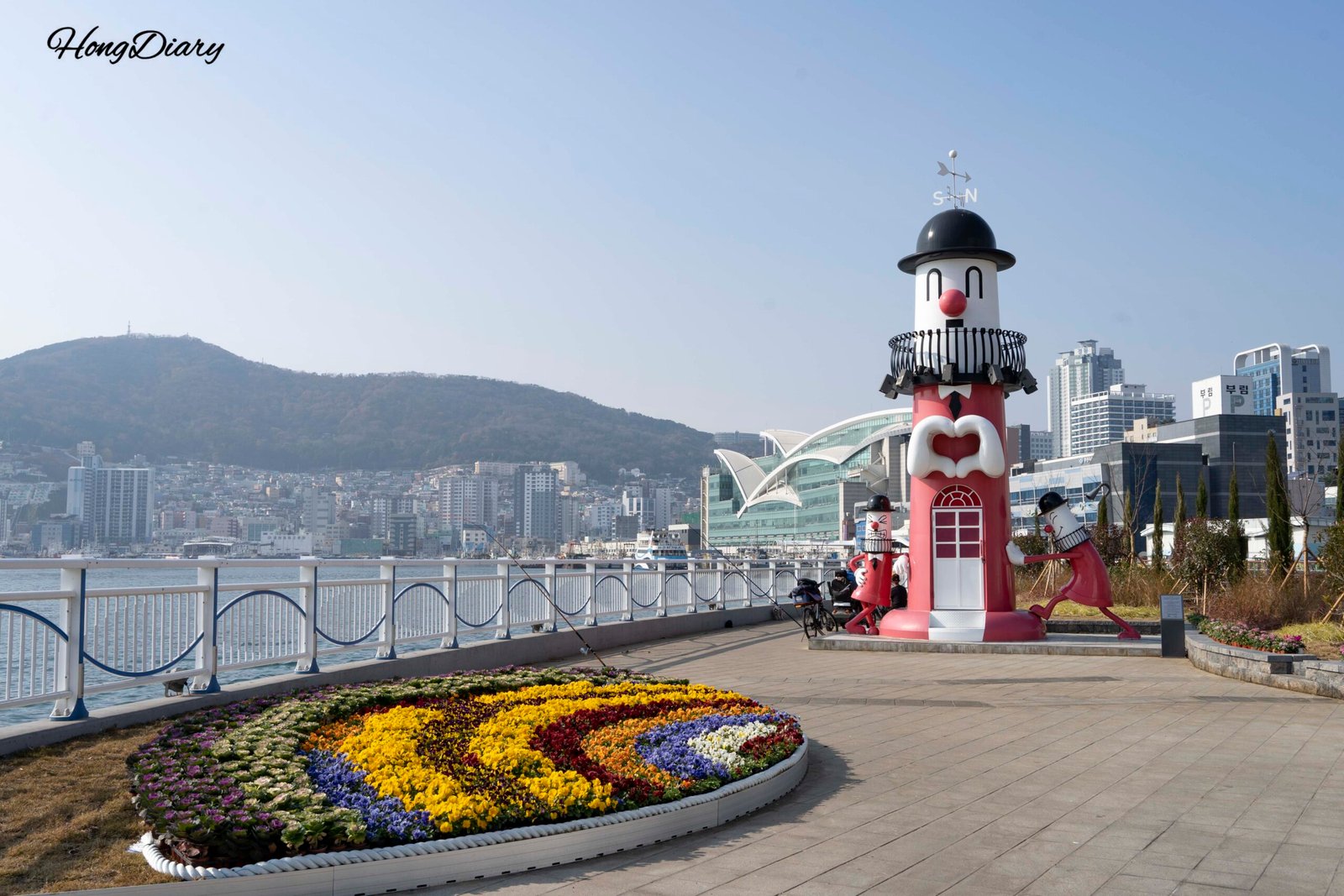 Colorful lighthouse and flower garden at Yeongdo waterfront — Busan walking route