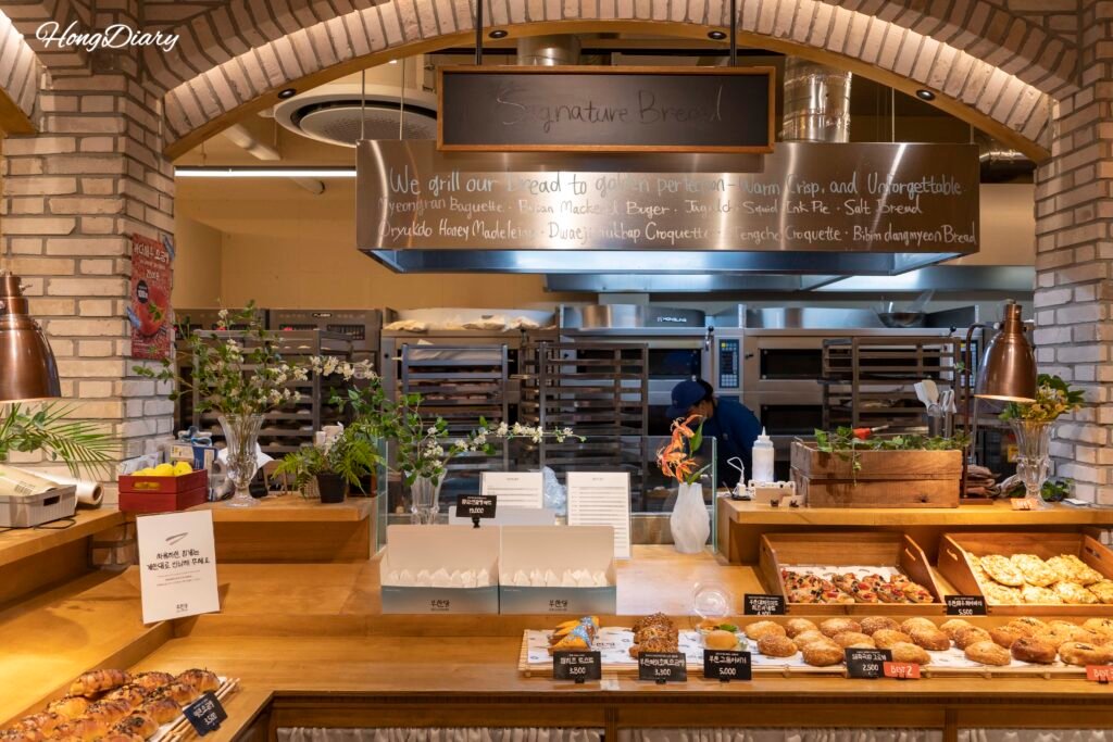Inside view of Busandang Bakery showing bread display shelves