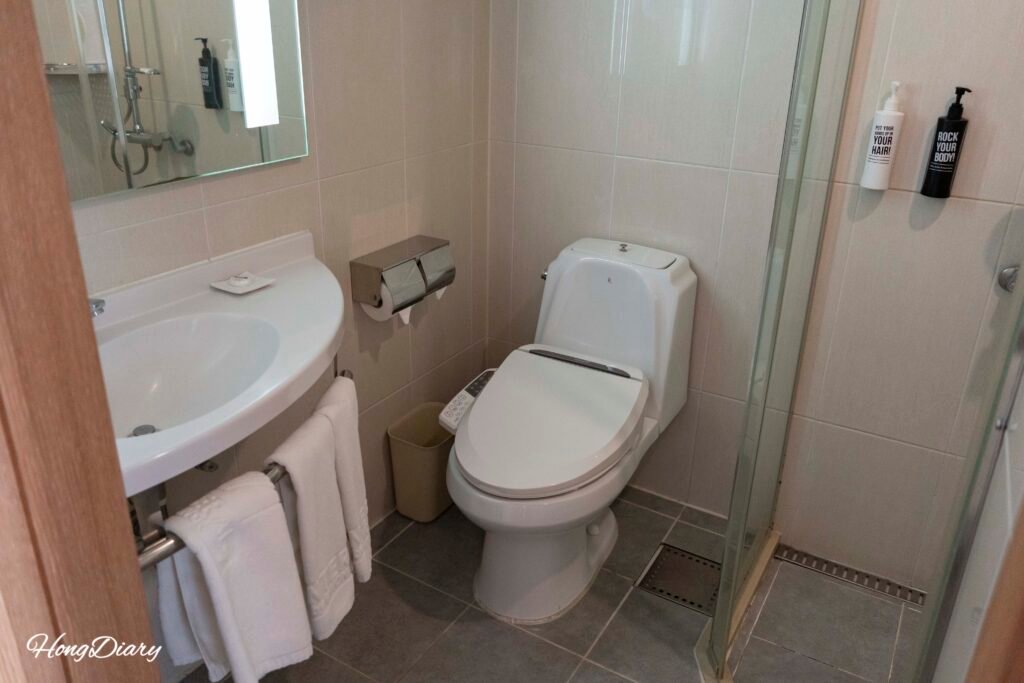 Bathroom with shower stall at Central Seven Hotel Busan
