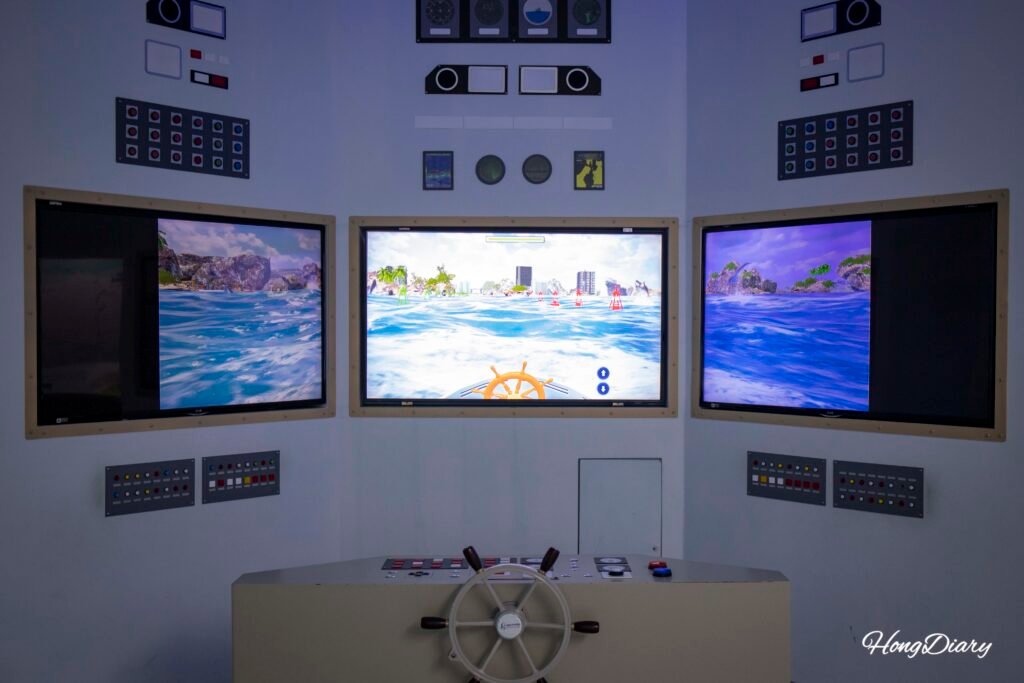 Visitors experiencing a fishing vessel simulation at the Busan Fisheries Science Museum