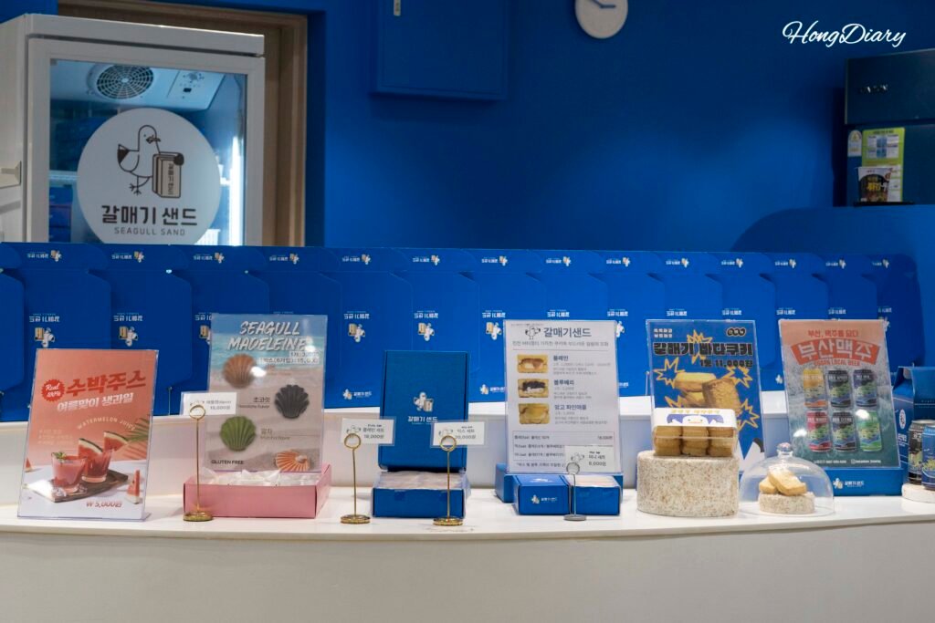 Full product range at Galmaegi Sand Busan Station including cookies madeleines and beer