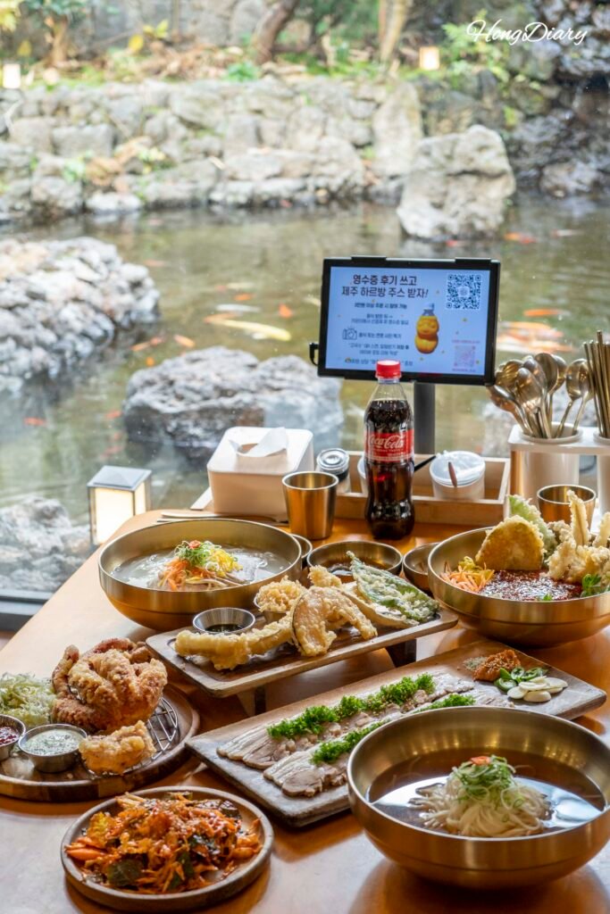 Feast-style set at Go Guksu with dombe pork and octopus salad, Jeju