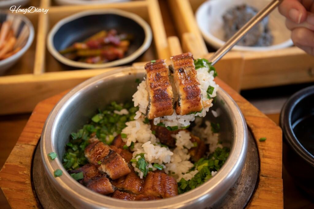 Spoonful of eel and rice from the dolsot rice pot at Handassot Gyeongju