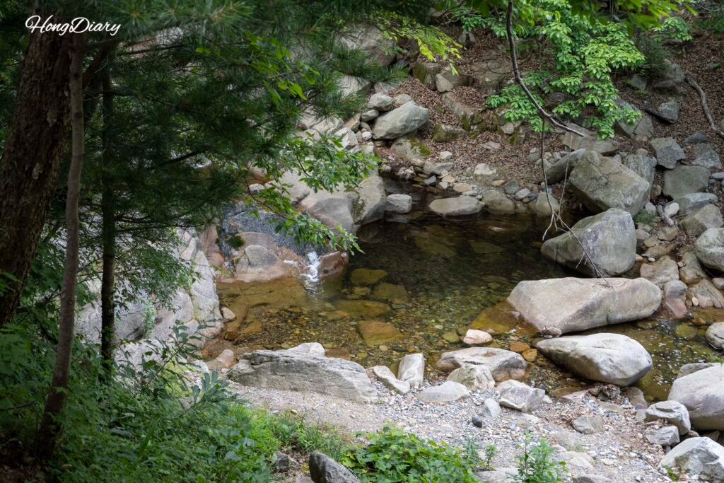 Clear stream flowing through Hobakso Valley Miryang with white granite rocks