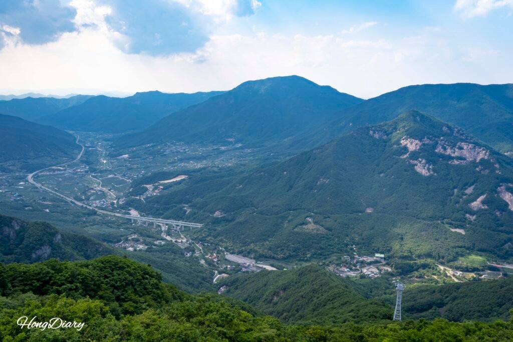 Yeongnam Alps ridgeline view from inside the Ice Valley Cable Car Miryang