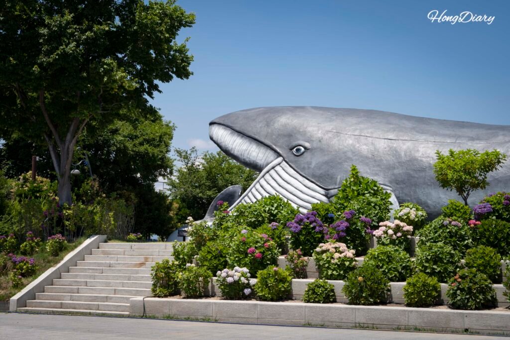 Whale sculpture in the outdoor park at Jangsaengpo Whale Culture Village