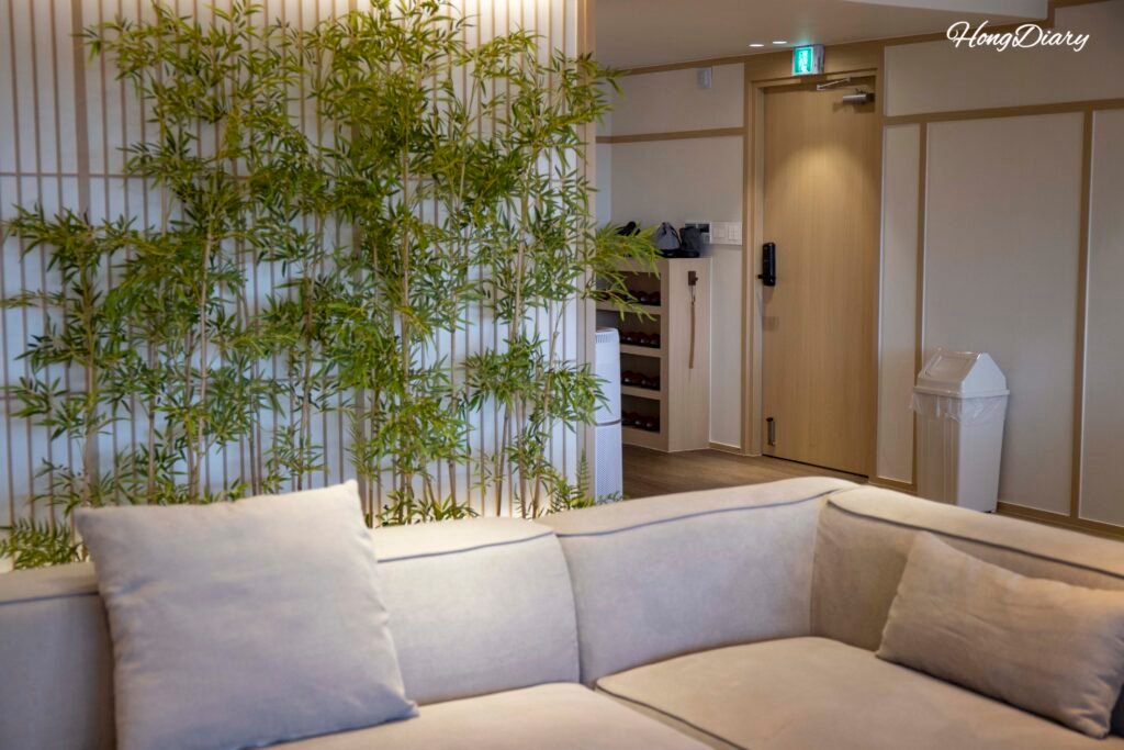Jeongonjae Cho room living area with sofa and large TV