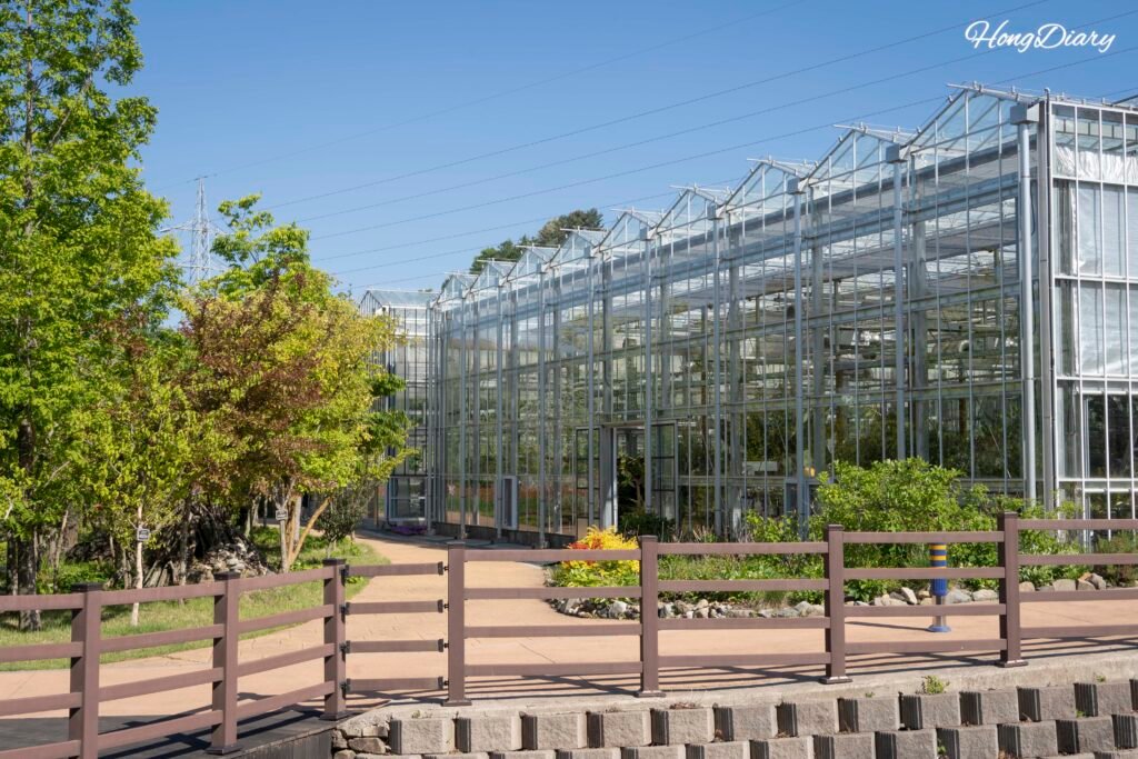Exterior of the botanical greenhouse at Dumesil Agricultural Theme Park, Jinju