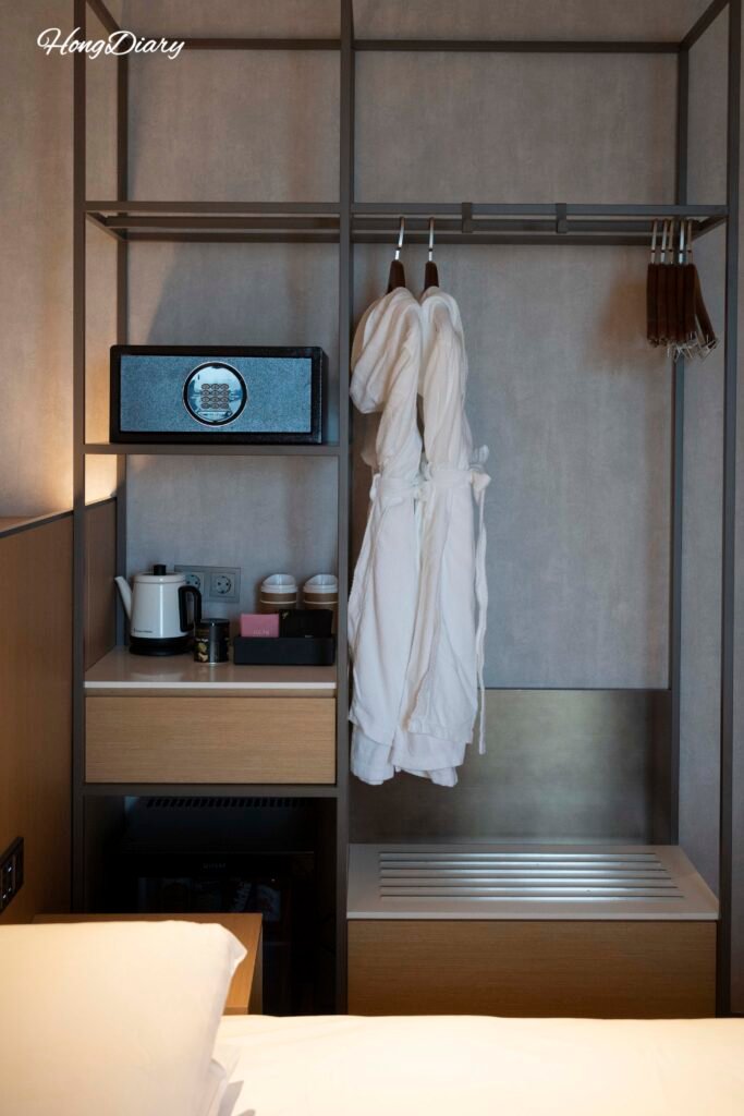 Wardrobe and luggage storage area inside L7 Haeundae hotel room