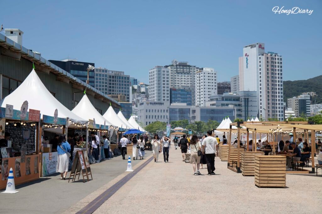 Outdoor area of Port Village Busan 2026 with harbor view