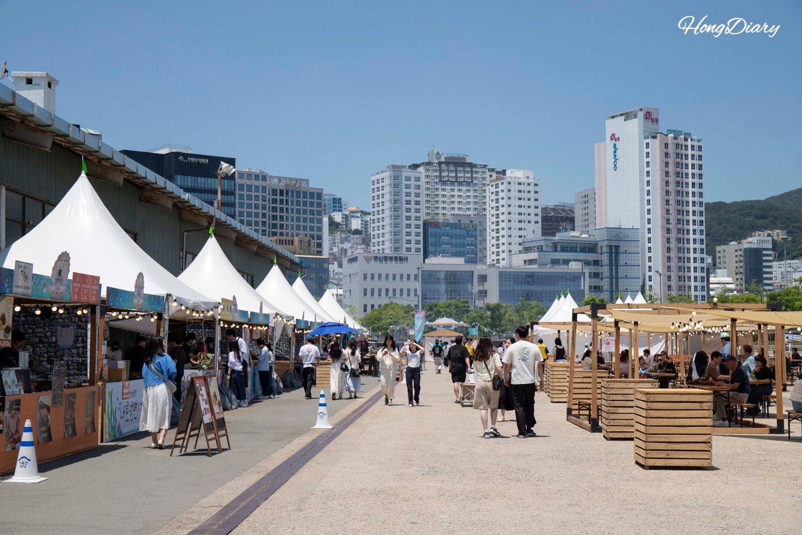Outdoor area of Port Village Busan 2026 with Busan Port harbor view