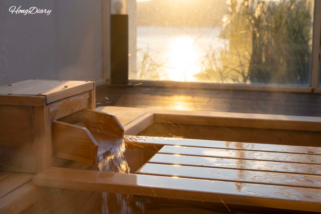 Private outdoor cypress bath on the terrace at Windyhill Resort, Geoje