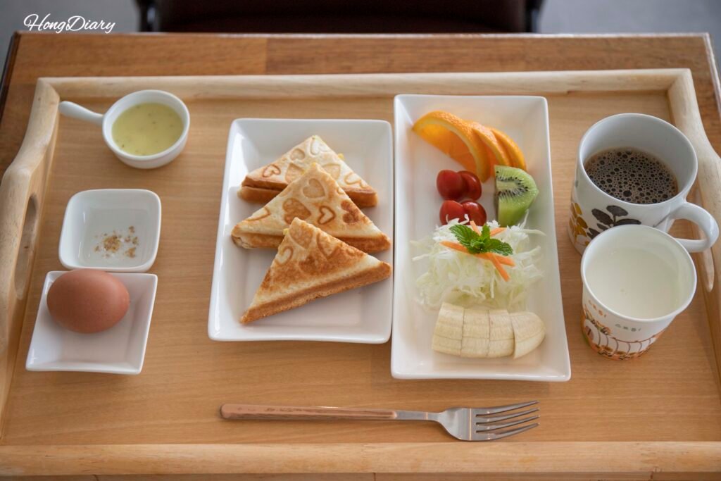 Free breakfast at Wonhwaru Gyeongju hanok stay including sandwich fruit egg and salad