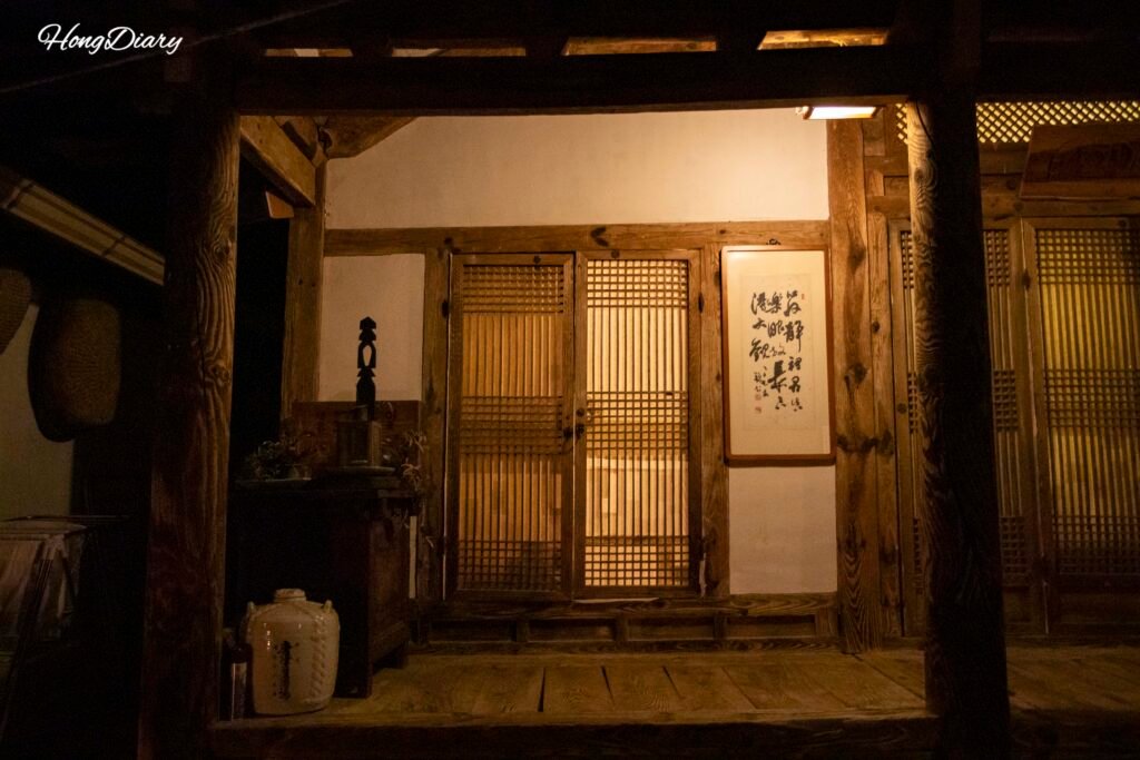 Yangsajae hanok guesthouse lit at night in Jeonju Hanok Village