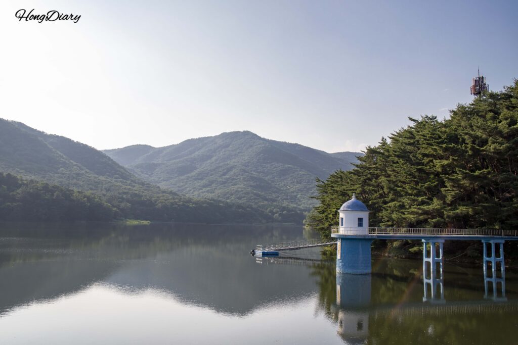 Panoramic view of the earthen dam and lake at Beopgi Reservoir, Yangsan