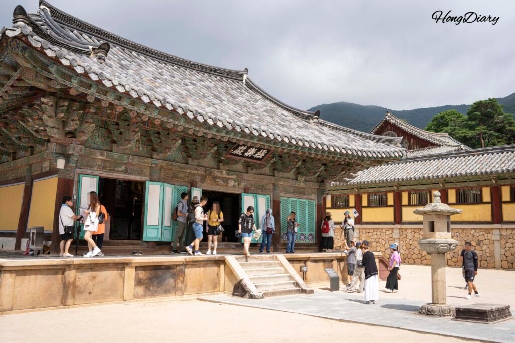 Interior courtyard of Bulguksa Temple in Gyeongju with traditional wooden buildings and stone pathways