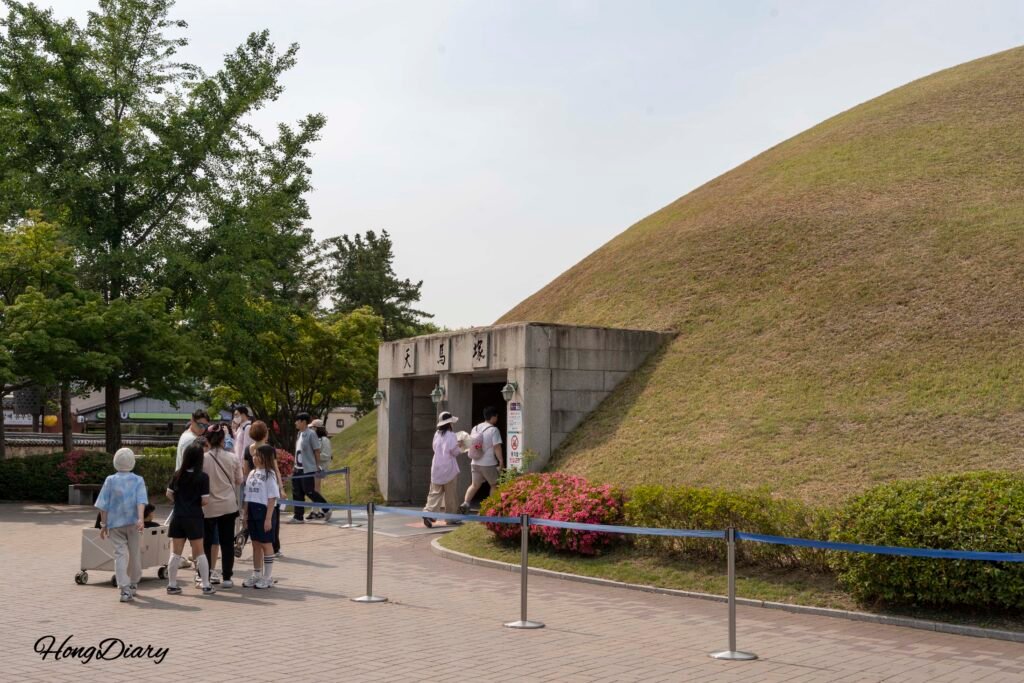 Grassy burial mounds at Daereungwon Tomb Complex in Gyeongju under soft evening light