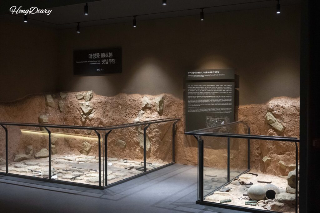 Exhibition section showing excavated royal tomb contents at the Daeseong-dong Tombs Museum