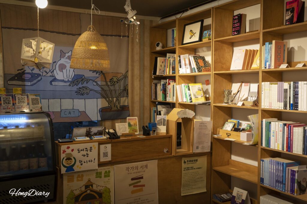 Interior of Durumi Bookshop with warm lighting and floor-to-ceiling bookshelves