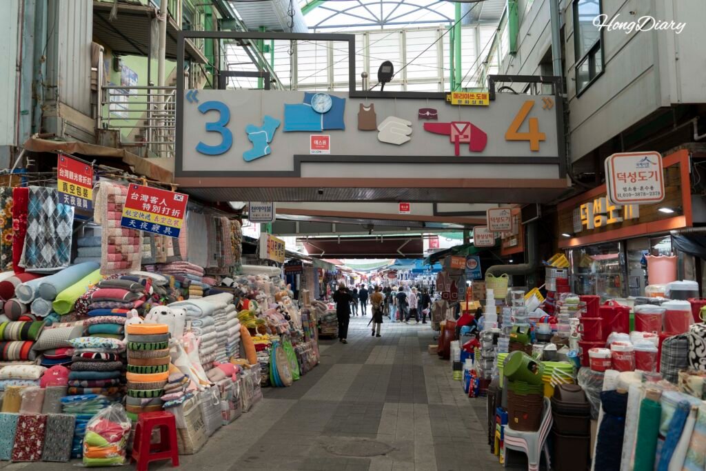 Narrow alley with market stalls inside Gukje Market, Busan