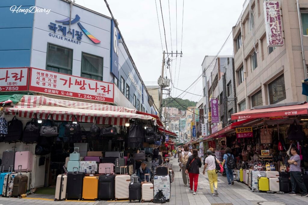 Covered alley inside Gukje Market in Busan with shops on both sides