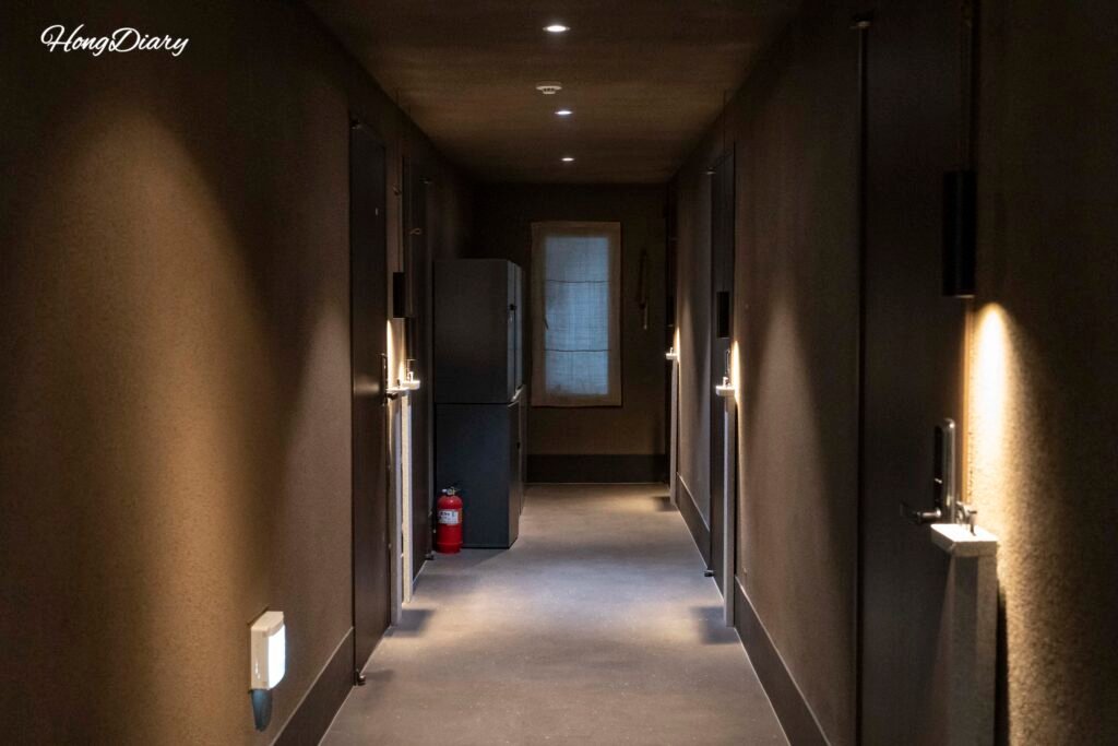 Clean, warmly lit hallway inside Gwangalli W Hotel in Busan