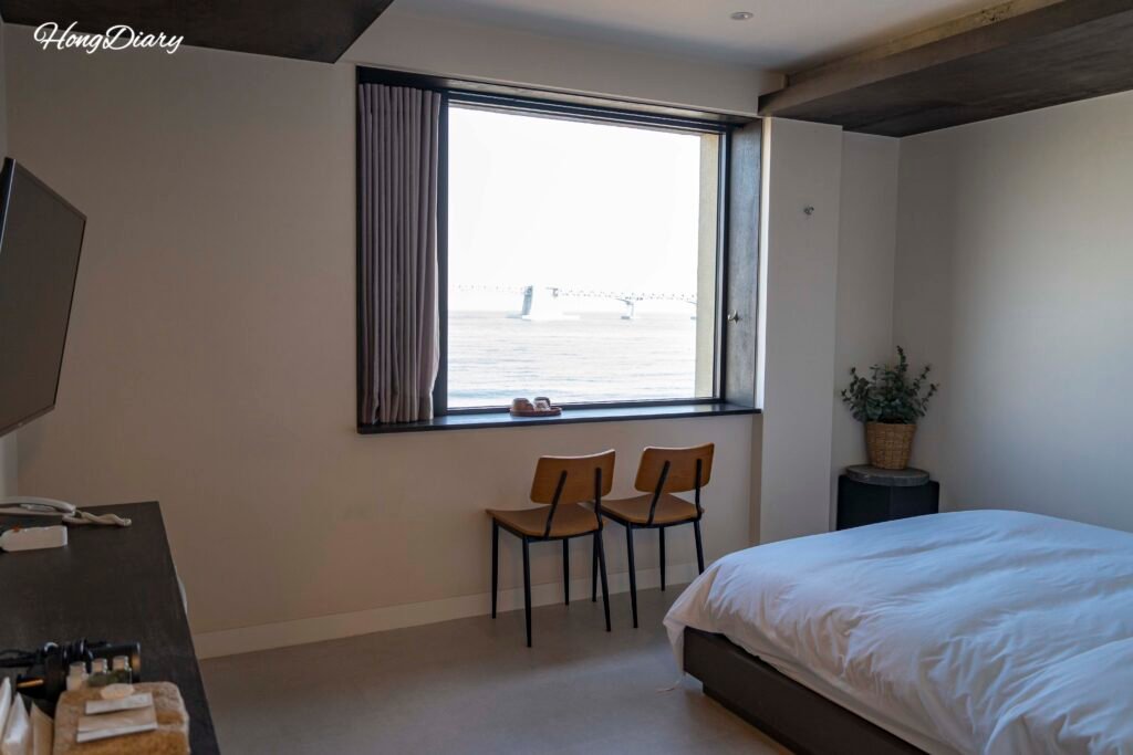 Ocean view double room at Gwangalli W Hotel with full-width window facing Gwangalli Beach