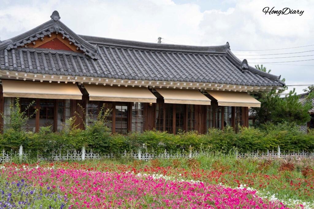 Traditional hanok building with curved tile roof housing a shop on Hwangnidan-gil in Gyeongju