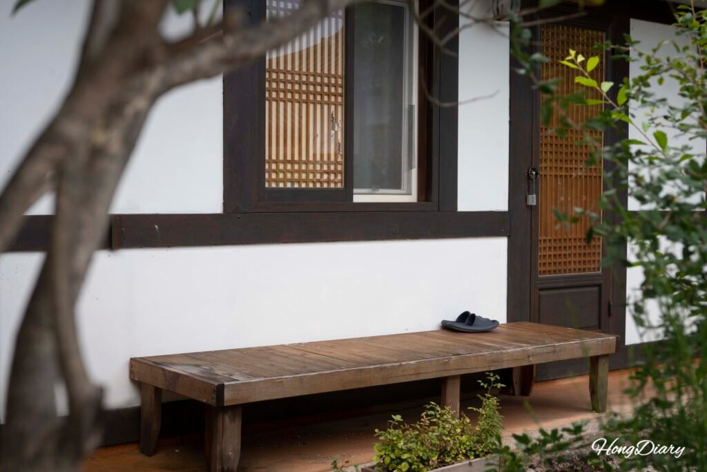Hanok-style storefront with dark wooden beams and tiled roof along Hwangnidan-gil in Gyeongju