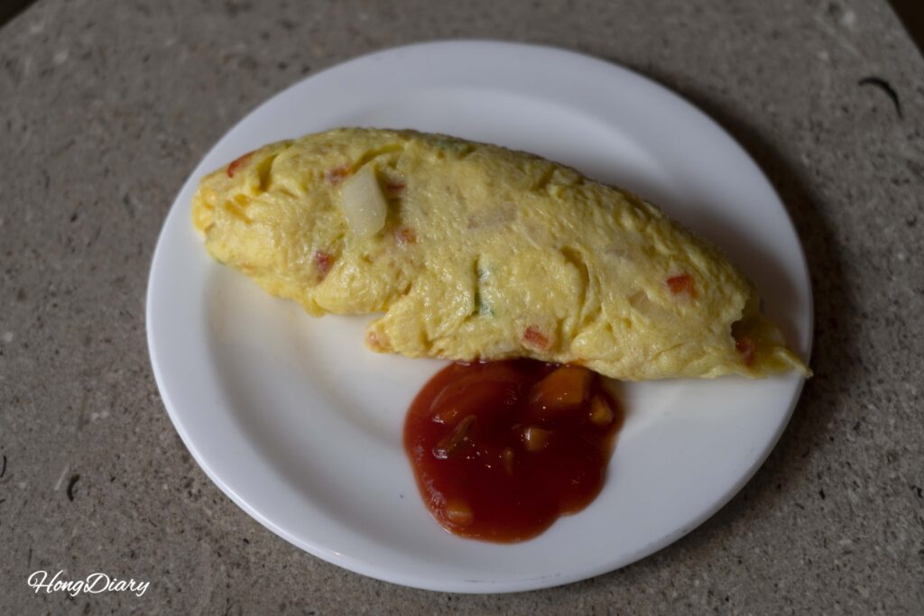 Omelet preparado en el desayuno del día siguiente en The Buffet at Inter-Burgo Daegu