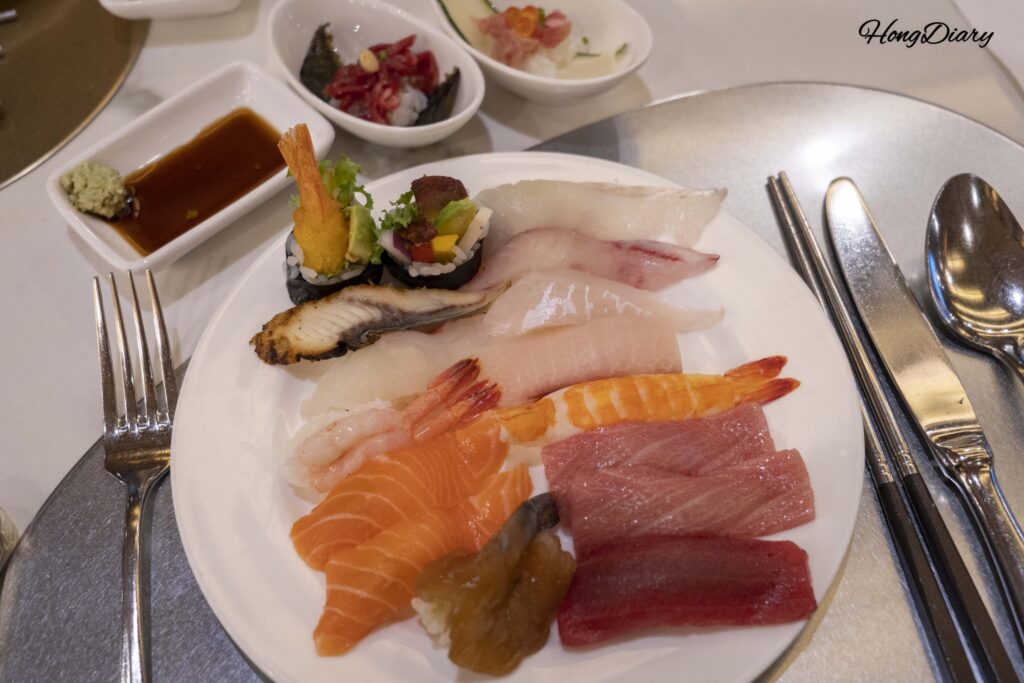 A plate of assorted sushi from The Buffet at Inter-Burgo Daegu including bluefin tuna and shrimp