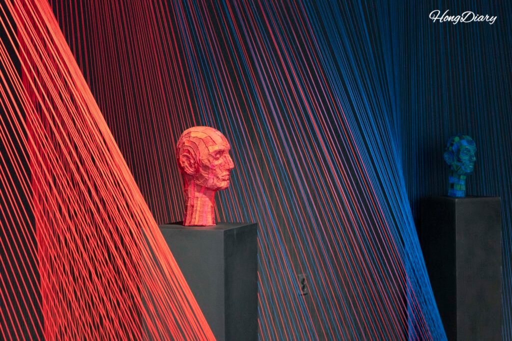 Silk art installation with dramatic lighting at the Jinju Silk Museum special exhibition hall