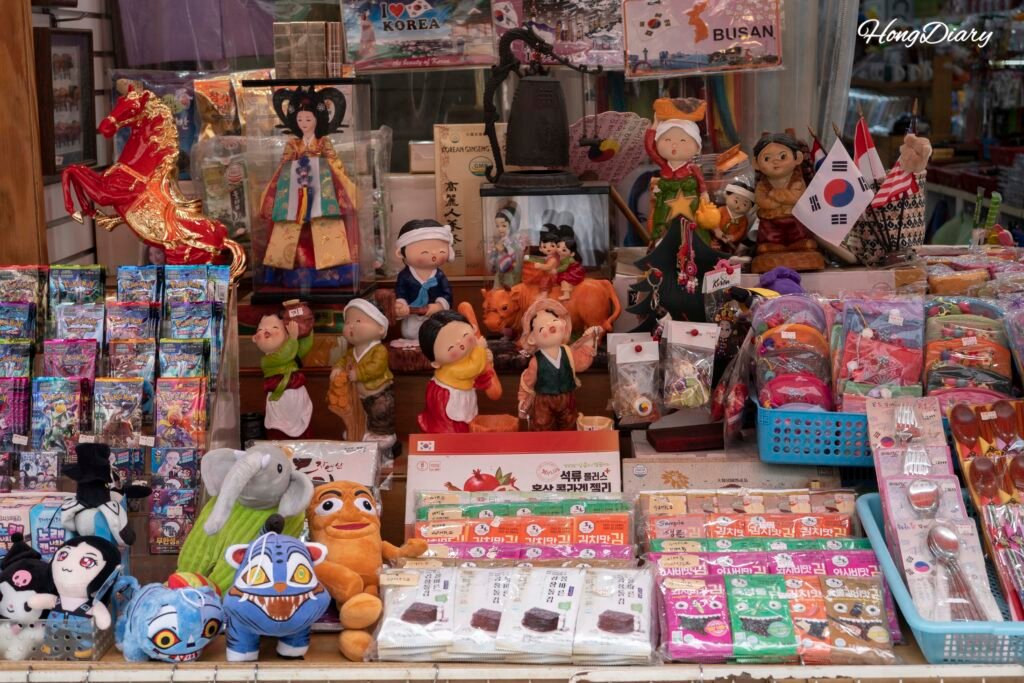 Korean souvenirs with Hangeul lettering and traditional designs on sale at Gukje Market
