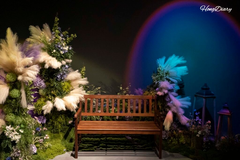 Visitor photo zone with a chair surrounded by immersive projections at Piorium Namwon