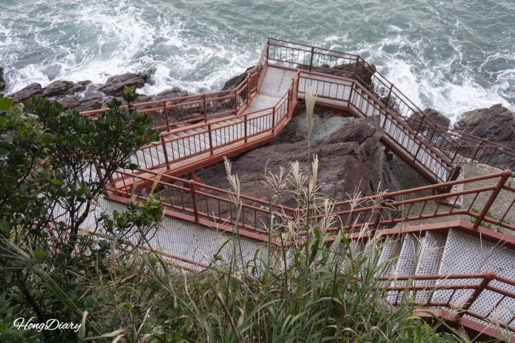Songdo Coastal Bolle Trail metal-deck walking path along the waterfront in Seo-gu, Busan