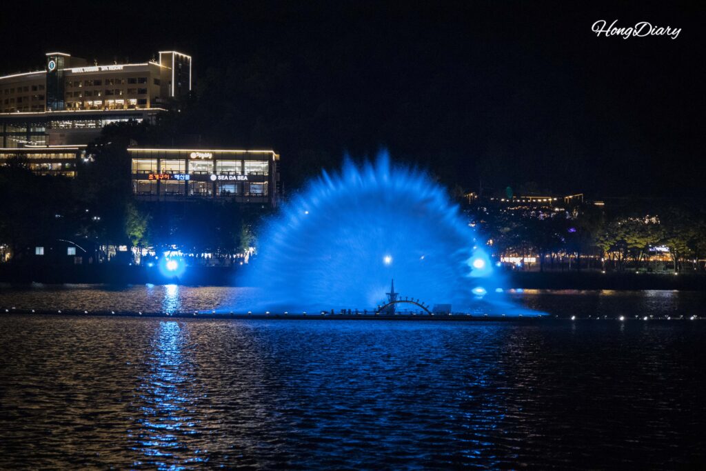 Nighttime music fountain main show at Suseongmot with colored lights and water choreography