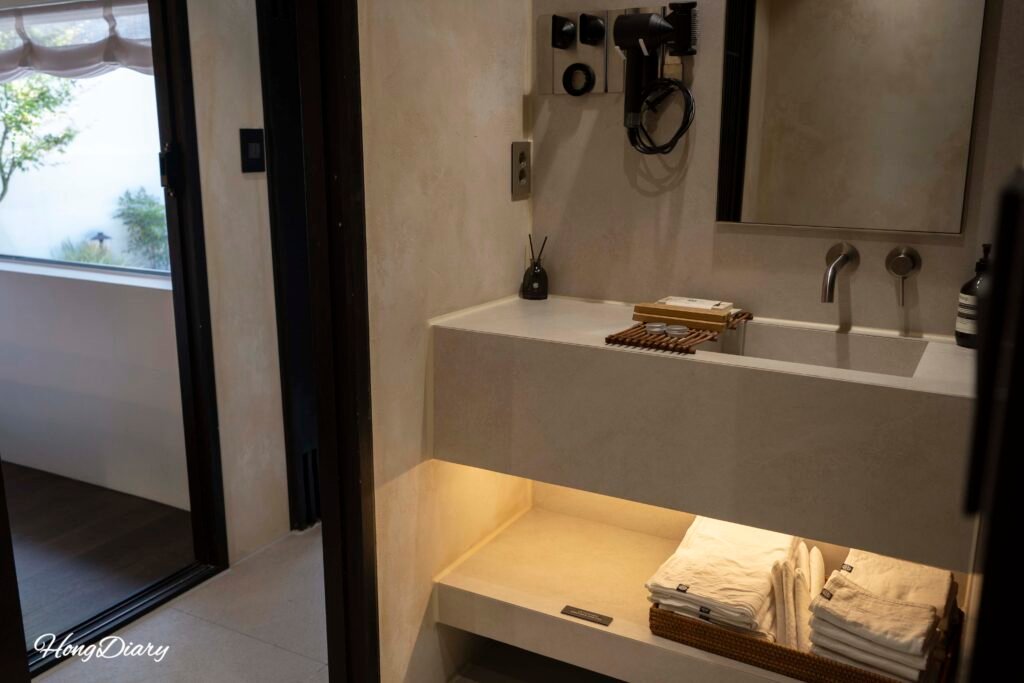 Separated bathroom with individual sink area at Yeojuhyeon hanok, Daegu