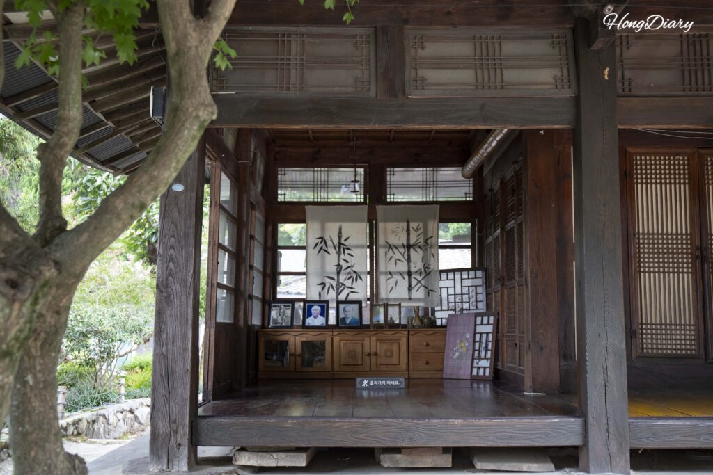 Inside Gwanmihyeon pavilion at Ahopsan Forest, with a bamboo ink-brush painting on display