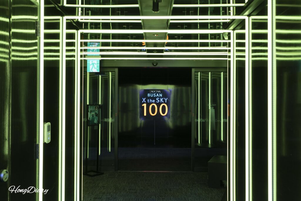 Inside the Sky Cruise elevator at Busan X the Sky with animated wall projections during the ride to the 100th floor