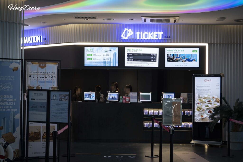 Self-service ticket machines and staffed counter at Busan X the Sky in Haeundae
