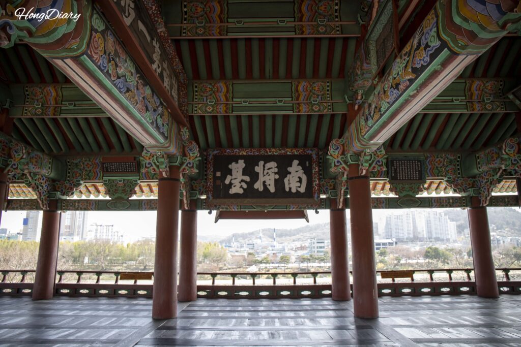 Interior of Chokseoknu Pavilion inside Jinjuseong Fortress, showing the open wooden structure overlooking Namgang River
