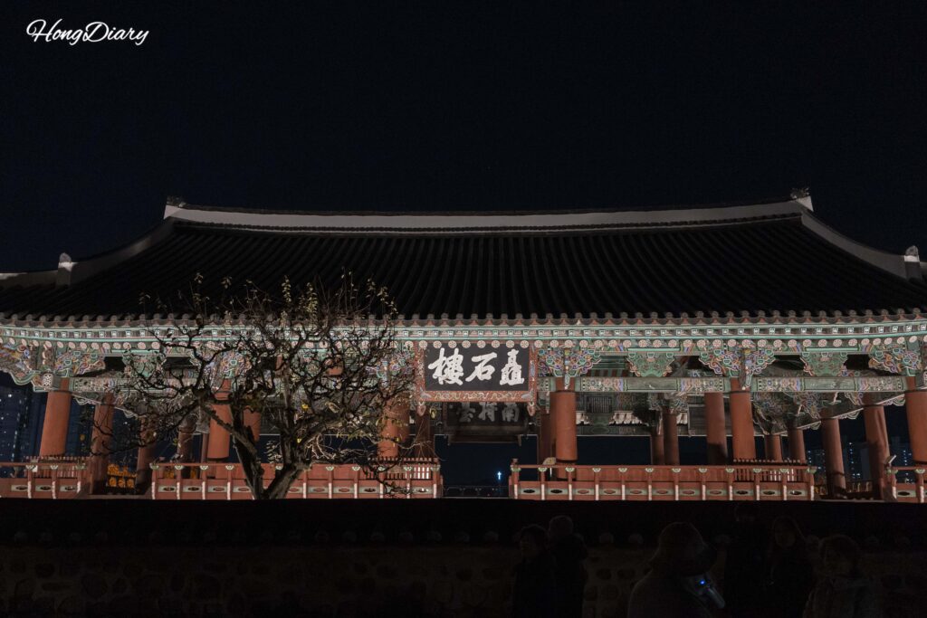 Chokseoknu Pavilion lit up at night inside Jinjuseong Fortress in Jinju