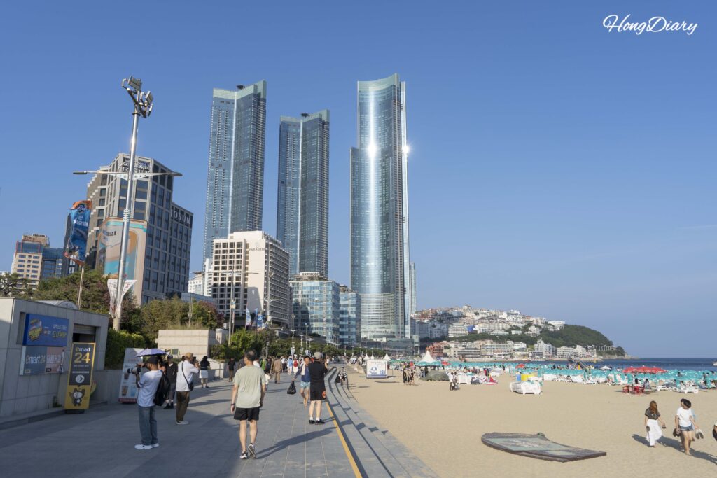 View of Haeundae Beach with LCT tower skyline and ocean from the sand