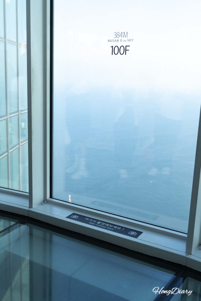 Panoramic view of Haeundae Beach seen from the 100th floor photo zone at Busan X the Sky