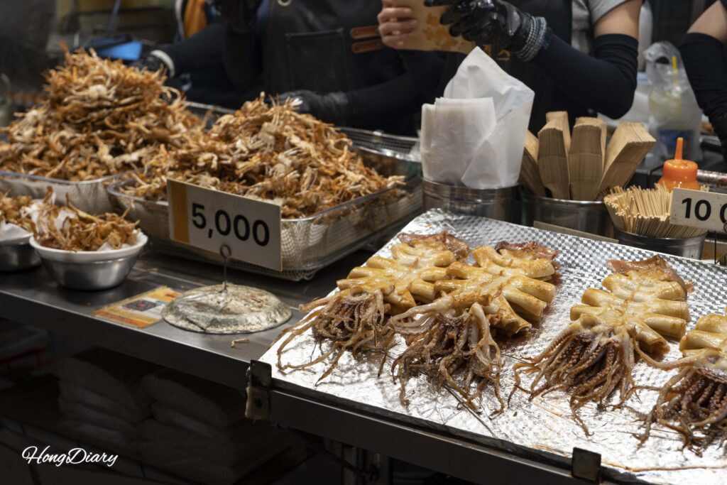 Butter-grilled squid being prepared on the street at Haeundae Traditional Market