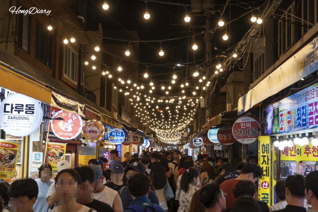 Walking through the packed alley of Haeundae Traditional Market in Busan