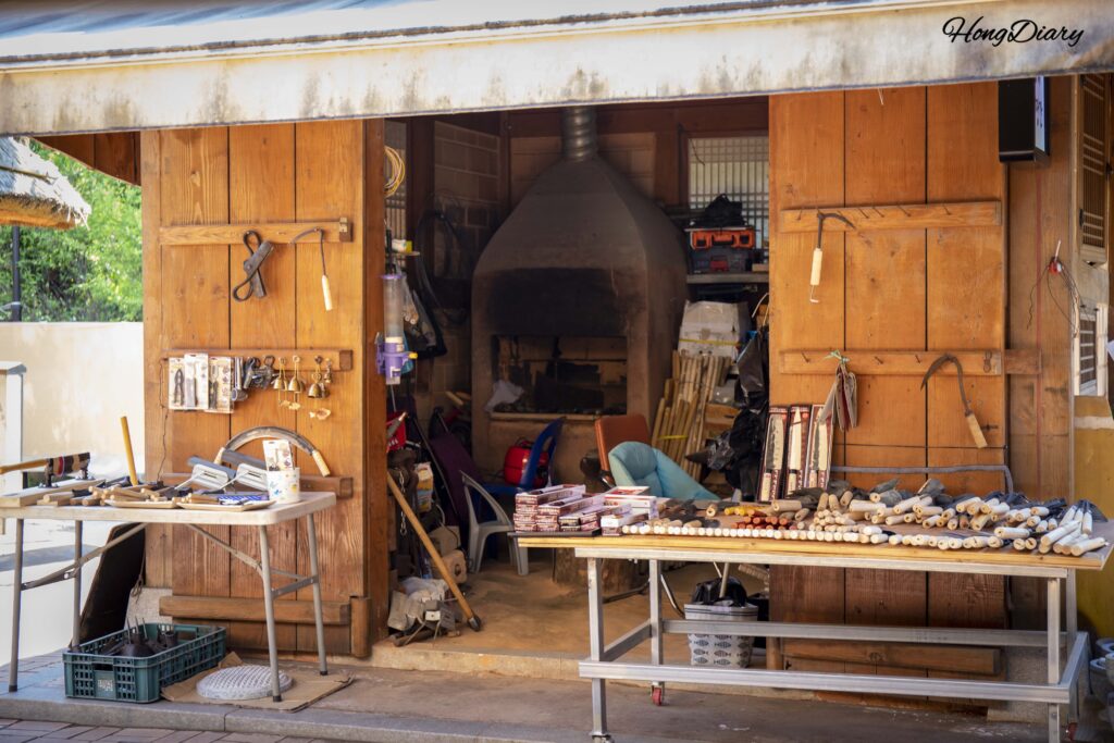 Working blacksmith shop inside Hwagae Market in Hadong